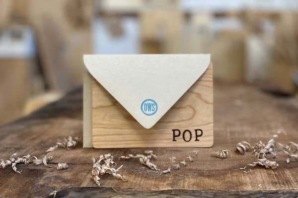 Wooden Father's Day card with a paper envelope and "POP" inscription.