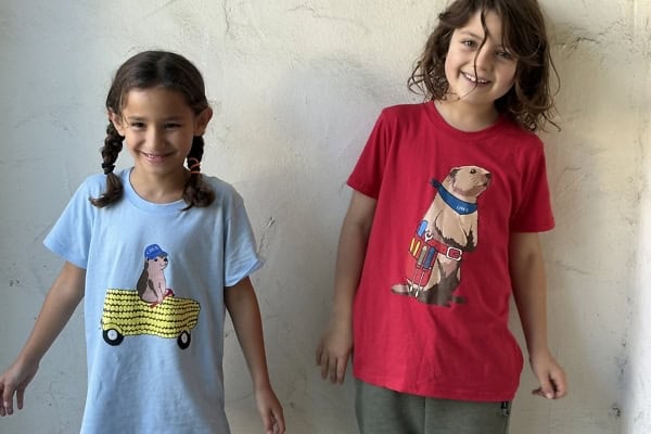 Kids wearing Little Woodchucks Youth T-shirts with fun animal prints.